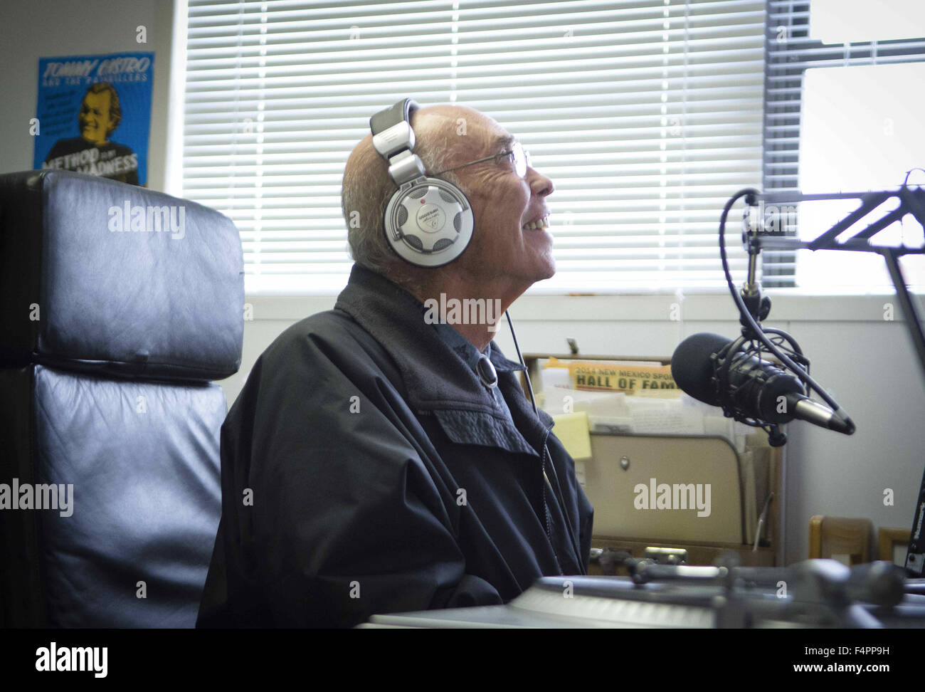 Albuquerque, NM, USA. 21st Oct, 2015. 102115.Alonzo Lucero, a DJ with KUPR 99.9, laughs while hosting the daily Spanish music show, in Placitas, N.M., Oct. 21, 2015. KUPR is a low power, 100 watt station that started airing in May 2015. © Marla Brose/Albuquerque Journal/ZUMA Wire/Alamy Live News Stock Photo