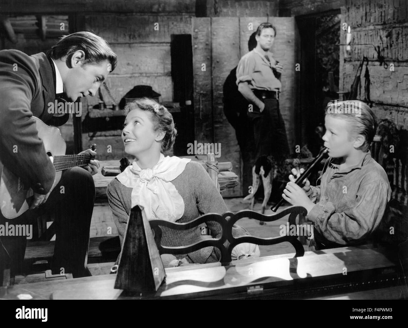 Robert Mitchum, Loretta Young, William Holden (behind) and Gary Gray / Rachel and the Stranger / 1948 directed by Norman Foster  [RKO Radio Pictures] Stock Photo
