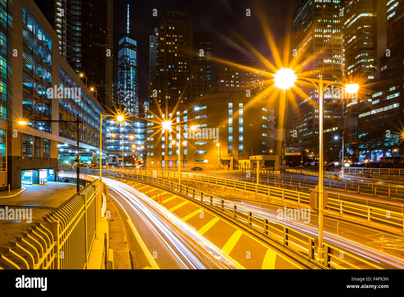 Traffic trails in downtown New York City at the entrance in Battery Park tunnel Stock Photo