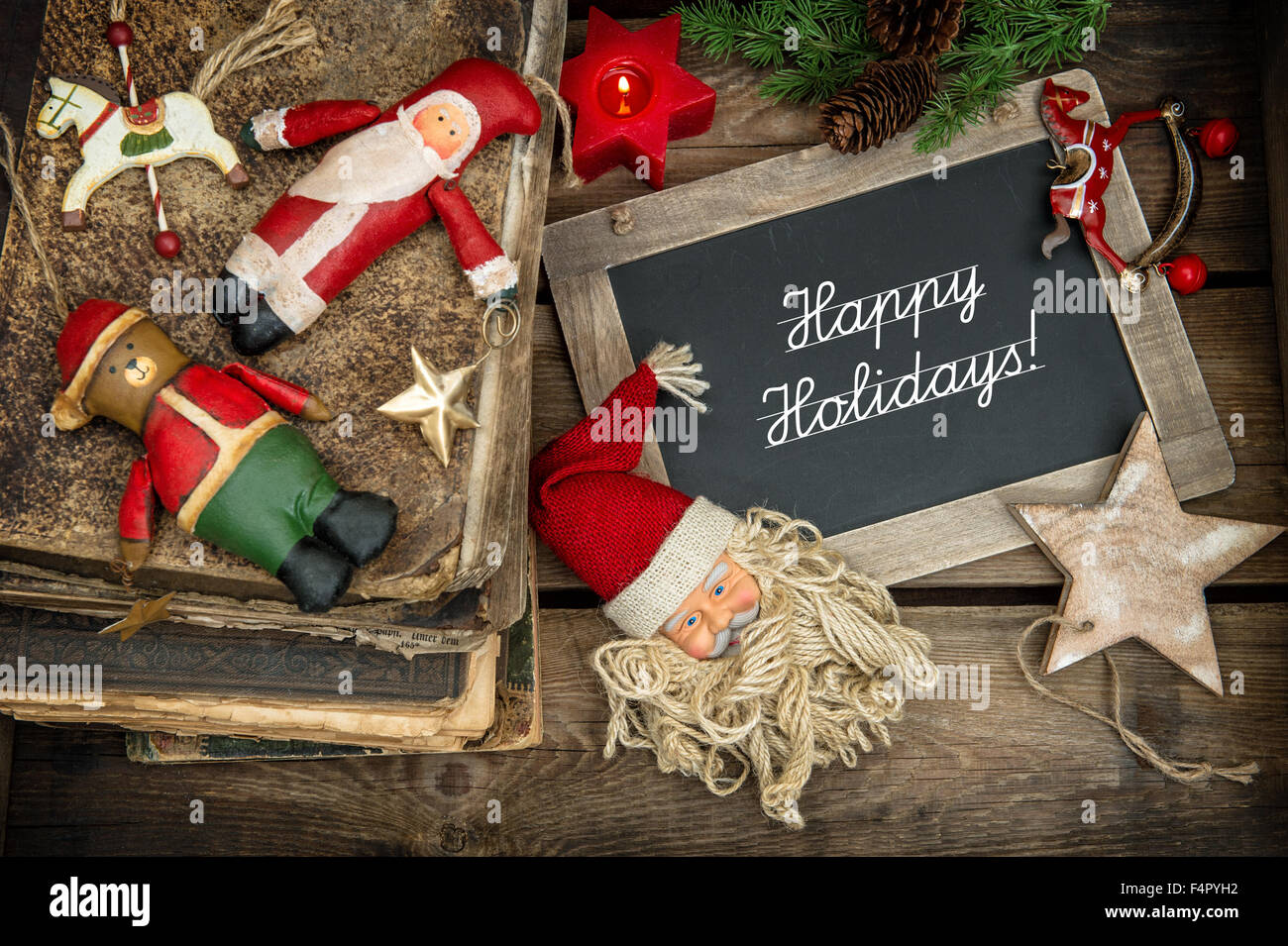 Christmas decoration with vintage baubles and toys on wooden background. Nostalgic retro style picture. Stock Photo