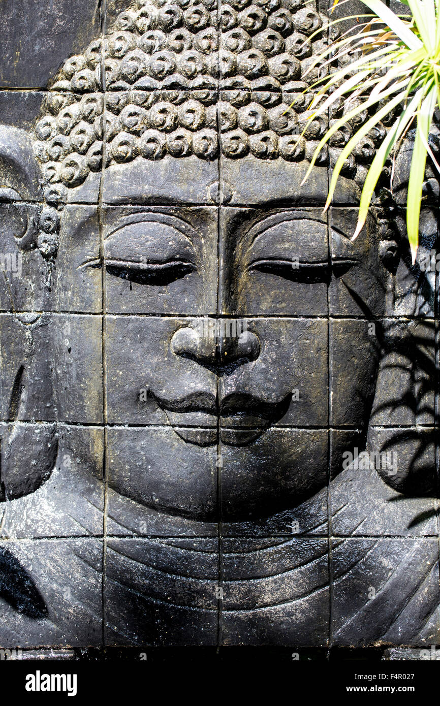 Portrait Carving (Cast) of Buddha's Head Portrait in Bali Indonesia Stock Photo