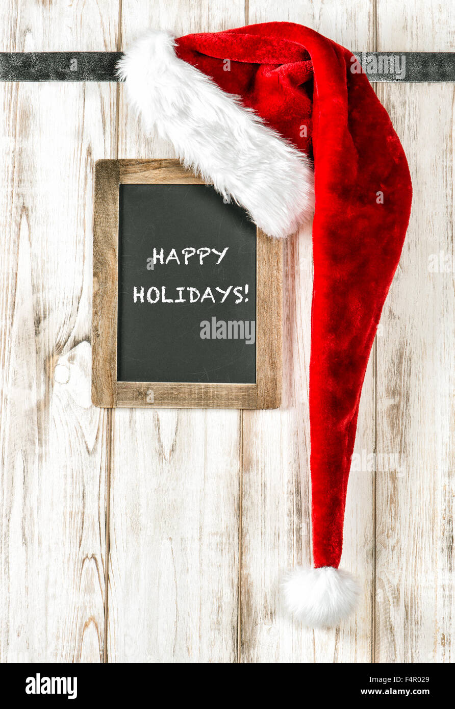 Red Santa Hat And Vintage Chalkboard With Sample Text Happy Holidays Retro Style Christmas Decoration Stock Photo Alamy