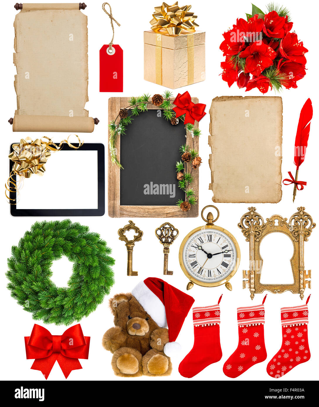 Christmas decoration, ornaments and gifts. Old book page, paper, scroll, wreath, blackboard, flowers isolated on white backgroun Stock Photo