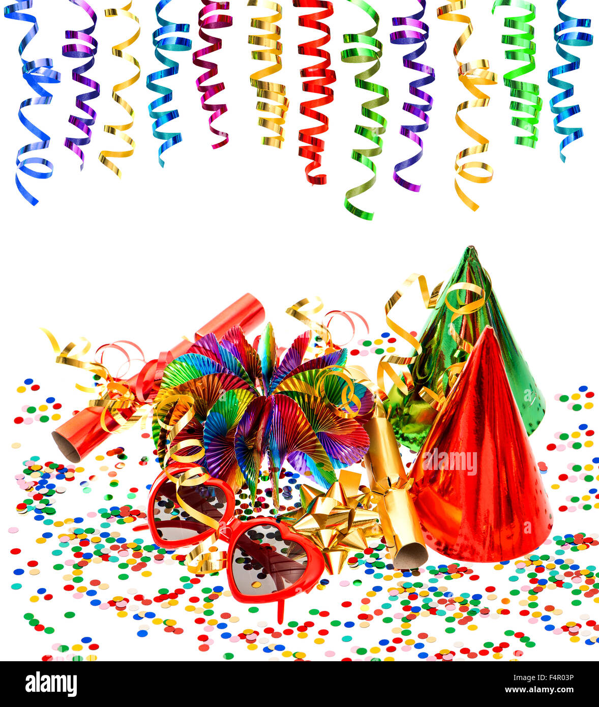 Party decoration with garlands, streamer, confetti, cracker, funny glasses on white background Stock Photo