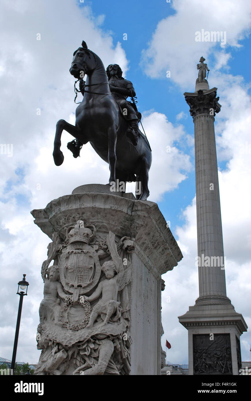 Statue of King Charles I on horseback in front of Nelson's Column in Trafalgar Square, London, England Stock Photo