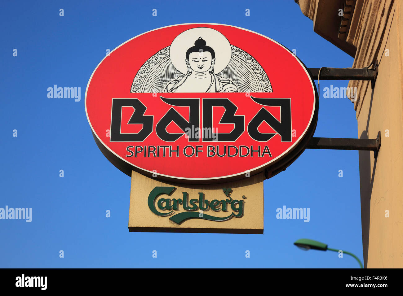 Advertising sign for an esoteric Buddhist business, local, in connection with advertising for beer Carlsberg, Brasov, Brasov, Tr Stock Photo