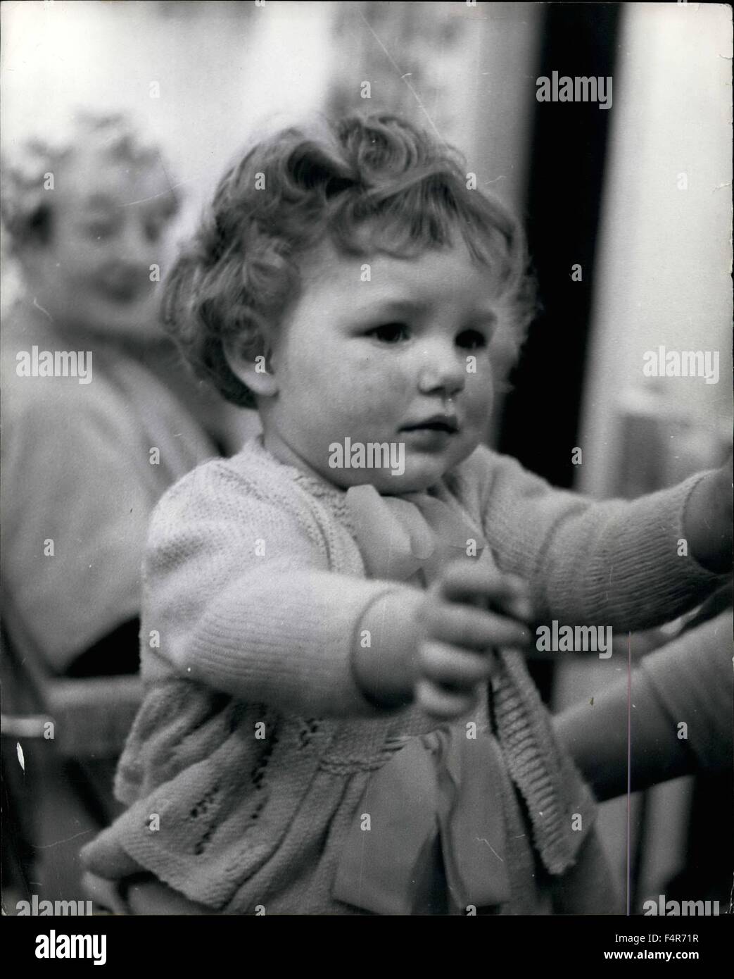 1955 - Baby Heather gets her first ''Perm'' ''Curly Head'' after the ordeal: Heather Tully walked into a beauty salon at Westlea, New Seaham, Co. Durham yesterday clutching her mother's hand and settled down to her first Permanent Wave. Hairdresser Pat Gilchrist said that the perm took almost an hour and Heather who is only twenty months old was as good as gold in fact the perfect customer no complaints. Her mother Mrs. Nora Tully, wife of a garage mechanic says that as Heather's hair is straight she will have a perm at least once a year. Photo shows Heather Tully with her curly head after the Stock Photo