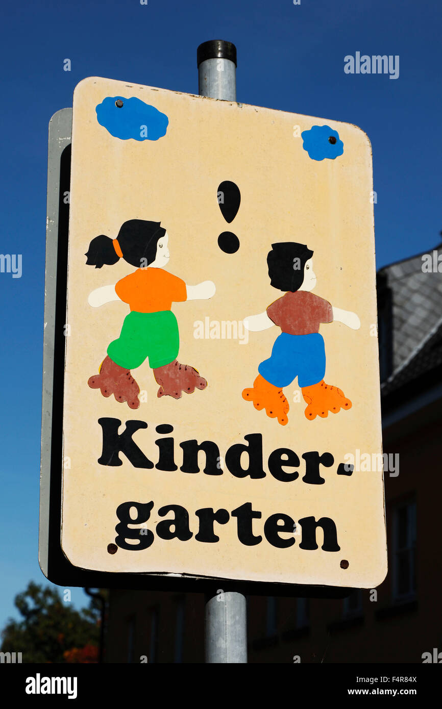 attention sign to car drivers and road users, direction sign of a kindergarten Stock Photo
