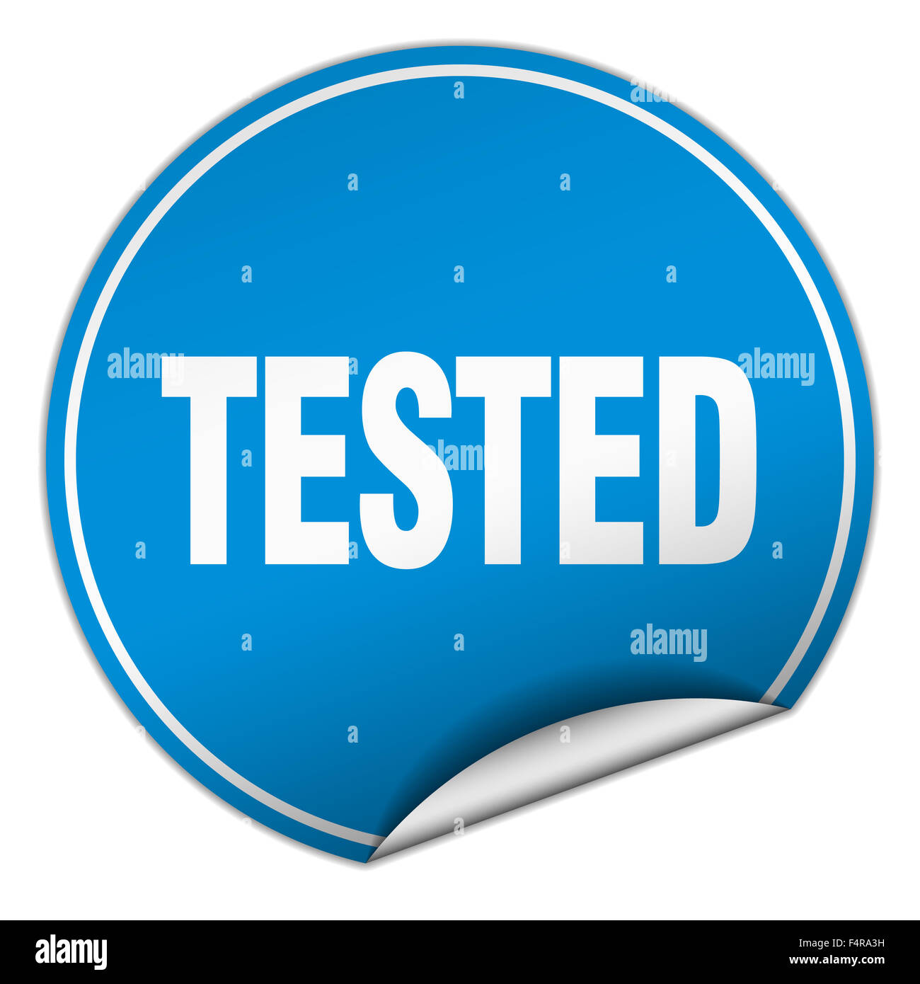 tested round blue sticker isolated on white Stock Photo - Alamy