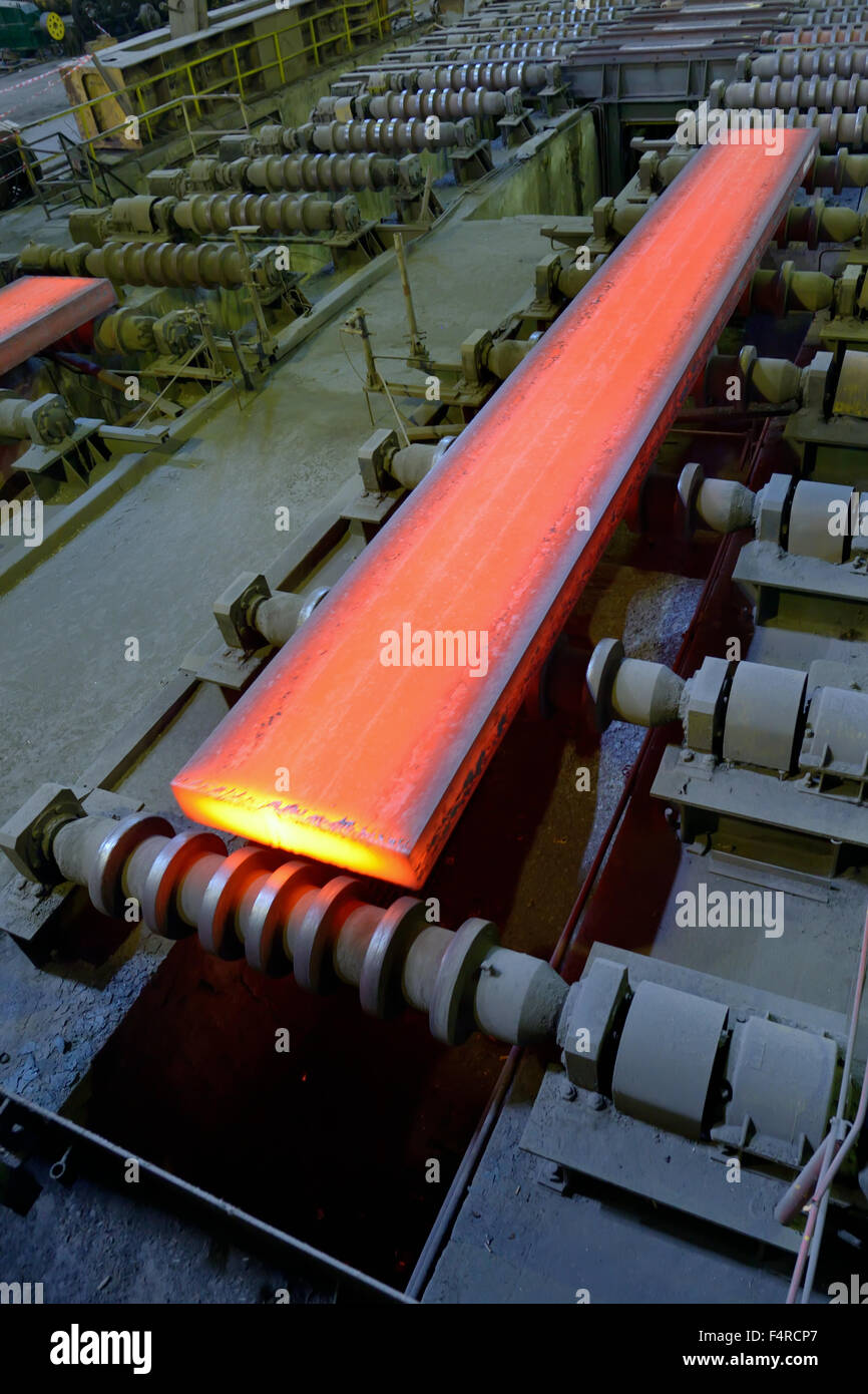hot steel on conveyor in steel plant Stock Photo