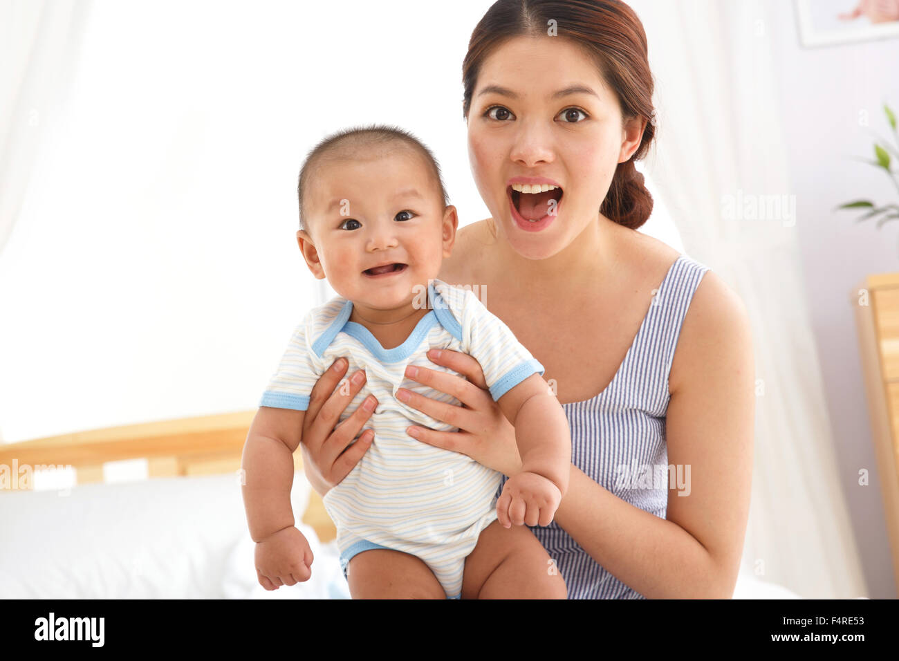 Mother holding the baby Stock Photo Alamy
