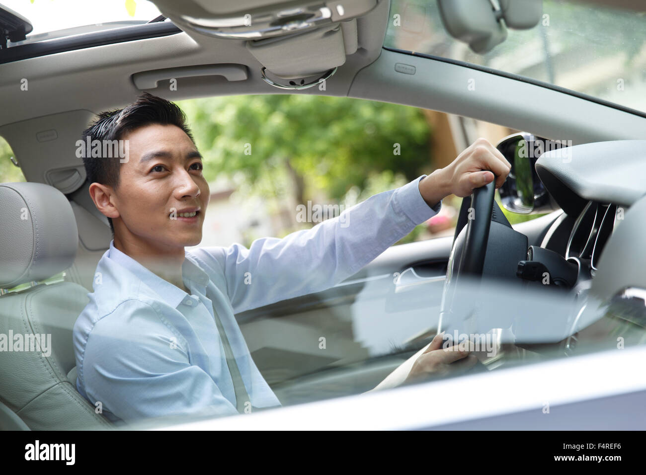 Young man driving Stock Photo