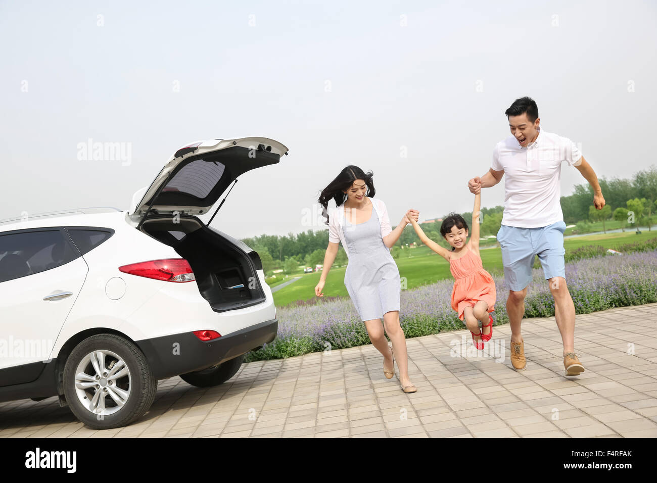 A happy family of three outdoor picnic Stock Photo - Alamy