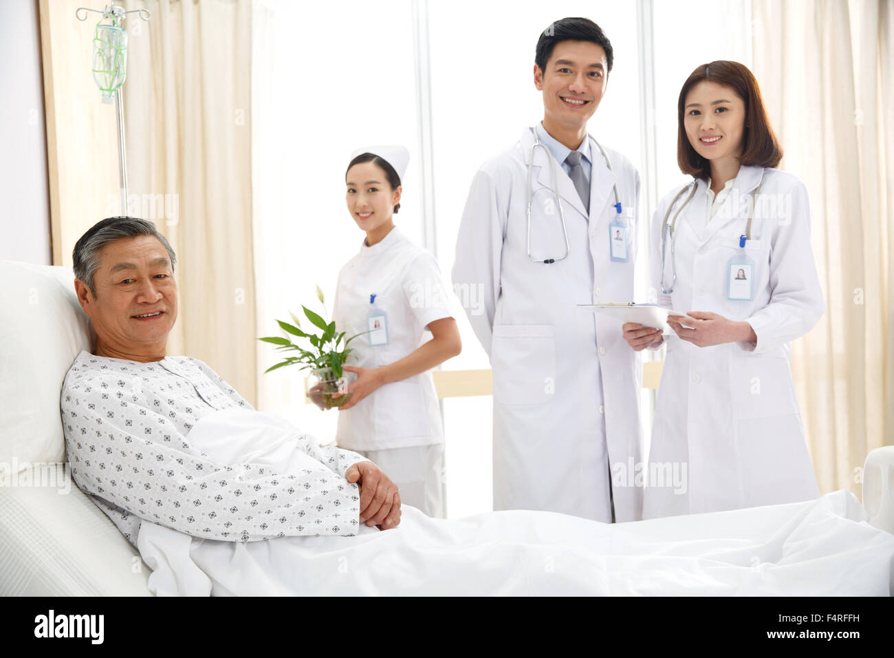 Medical workers and patients in the ward Stock Photo