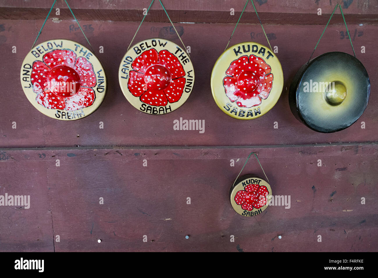 Traditional gongs for sale on display during Sunday market at the village in Kudat Sabah, Borneo, Malaysia Stock Photo