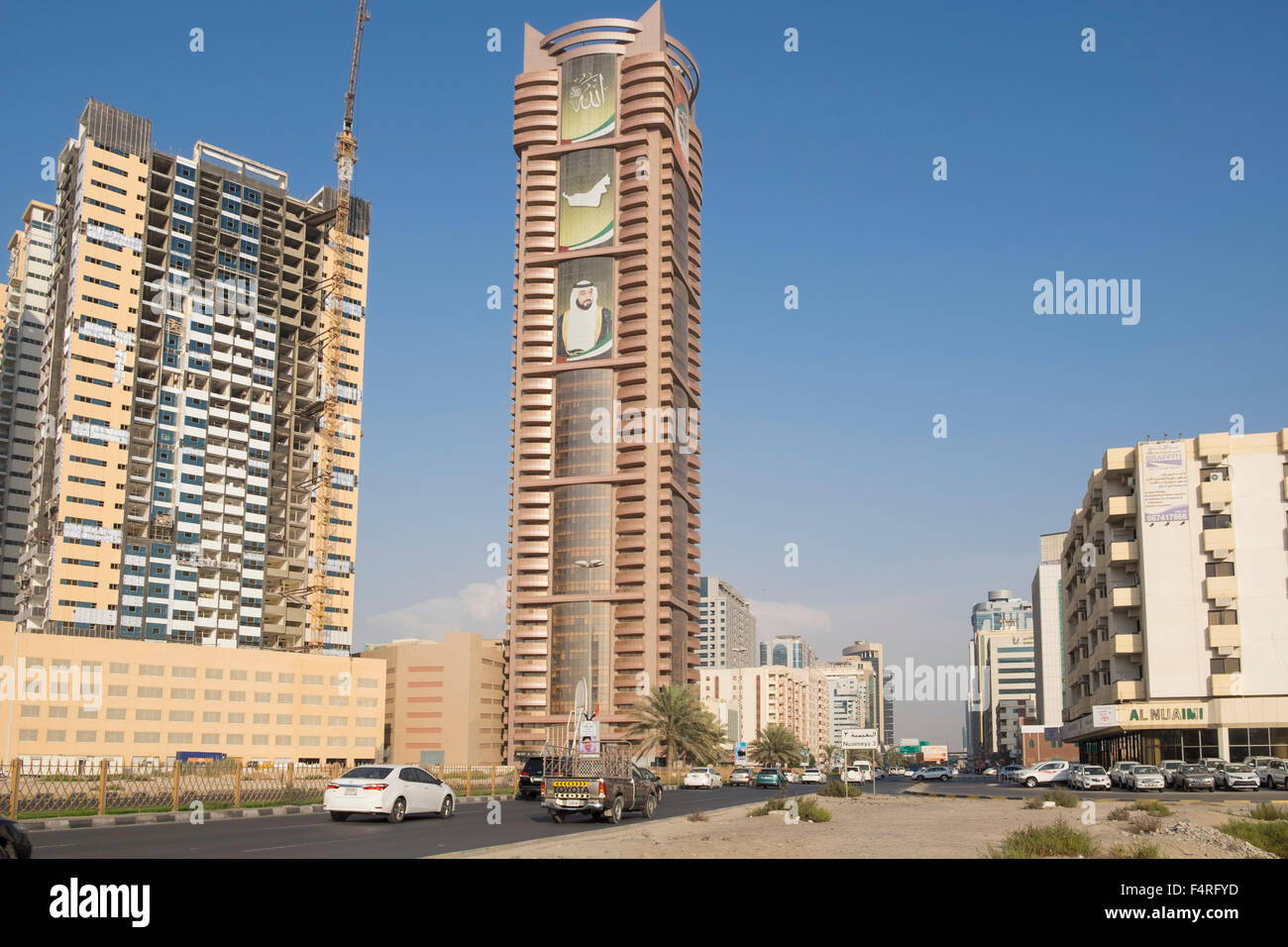 View of street and high-rise modern buildings in Ajman emirate in United Arab Emirates Stock Photo