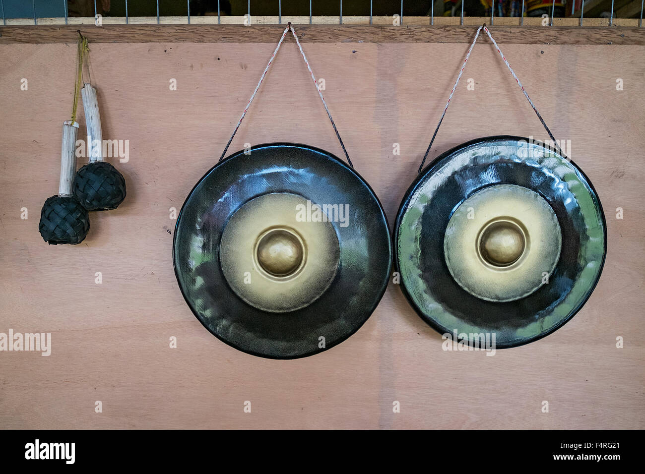 Traditional gongs for sale on display during Sunday market at the village in Kudat Sabah, Borneo, Malaysia Stock Photo