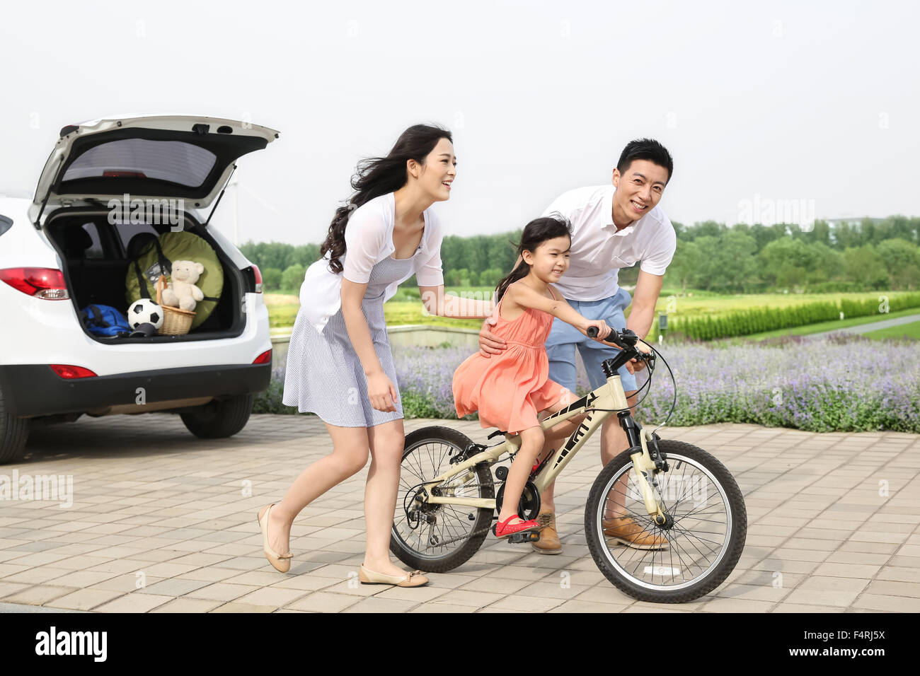 A happy family of three outdoor picnic Stock Photo - Alamy