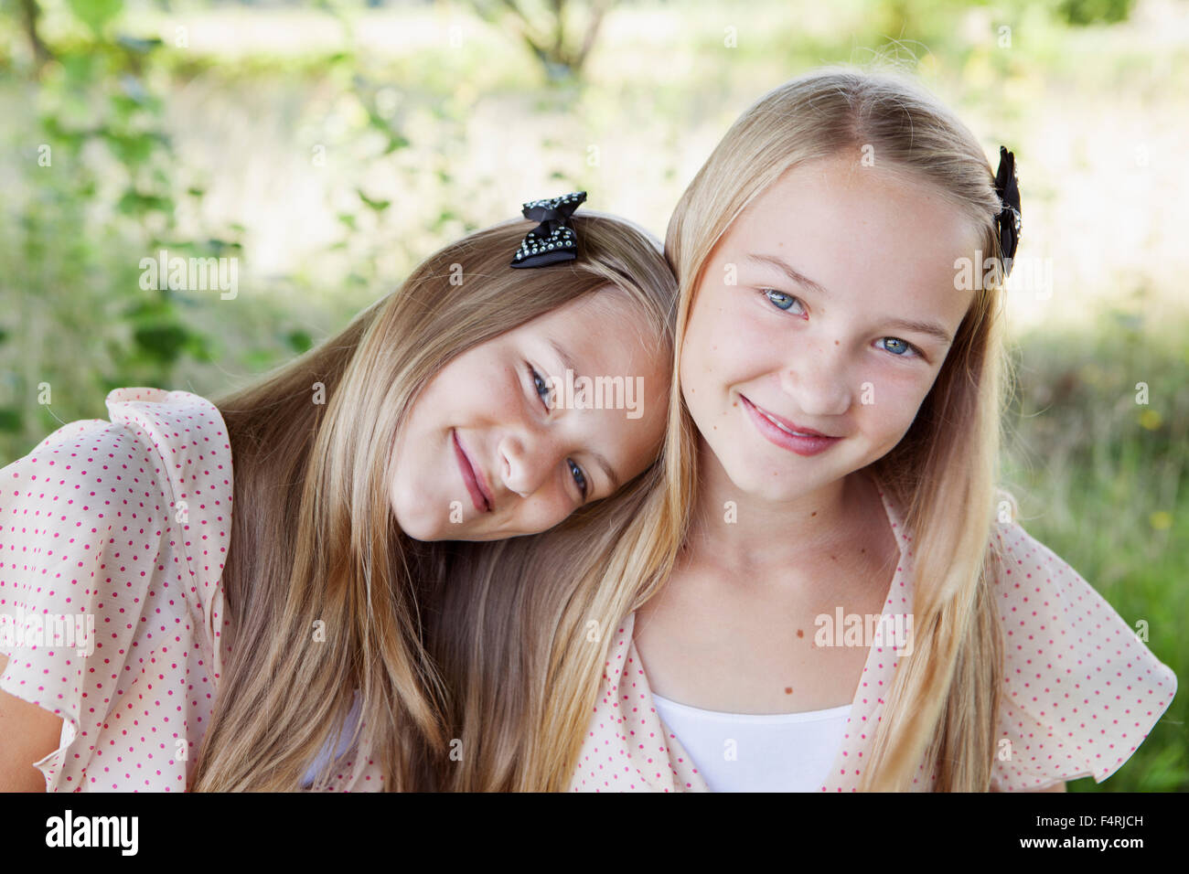 Sweden, Gotland, Eksta, Portrait of two girls (12-13 years) smiling Stock Photo