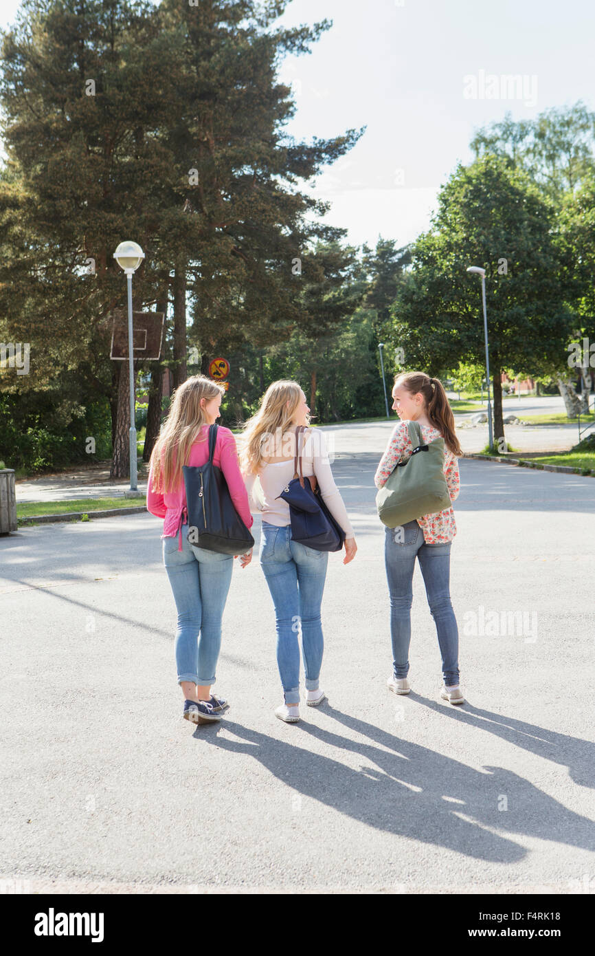 Sweden, Sodermanland, Nacka, Teenage girls (14-15) walking in park Stock Photo