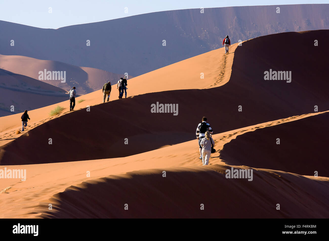 People climbing the Sand Dunes by Deadvlei salt lake Stock Photo - Alamy