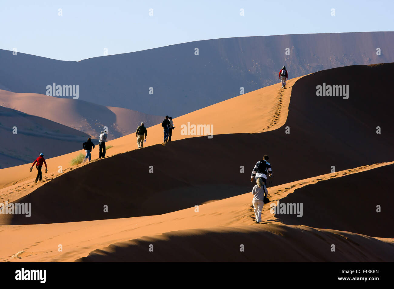 People climbing the Sand Dunes by Deadvlei salt lake Stock Photo - Alamy