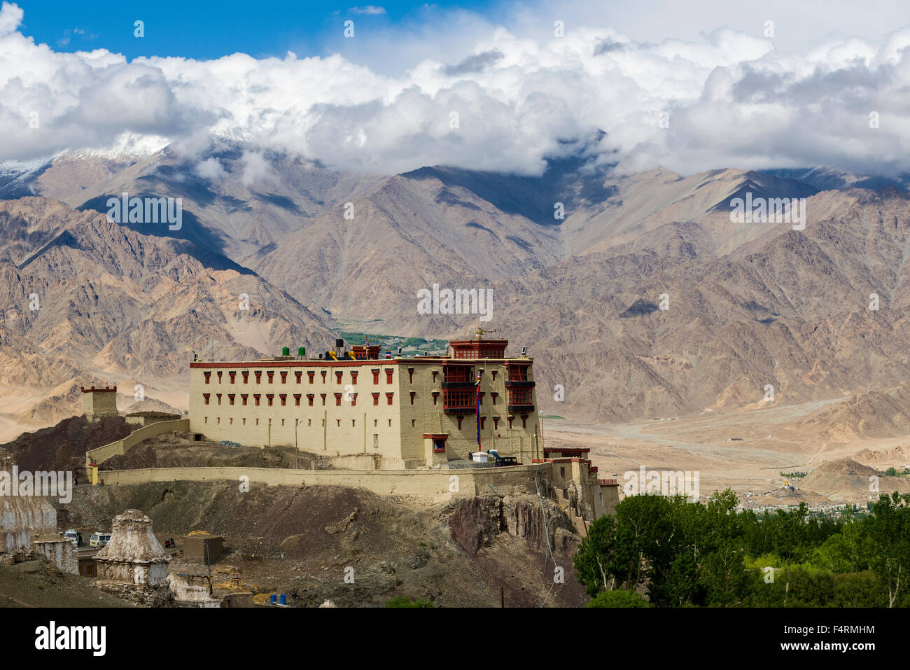 The Stock Palace is located on a hill above the Indus Valley, high mountains in the distance Stock Photo