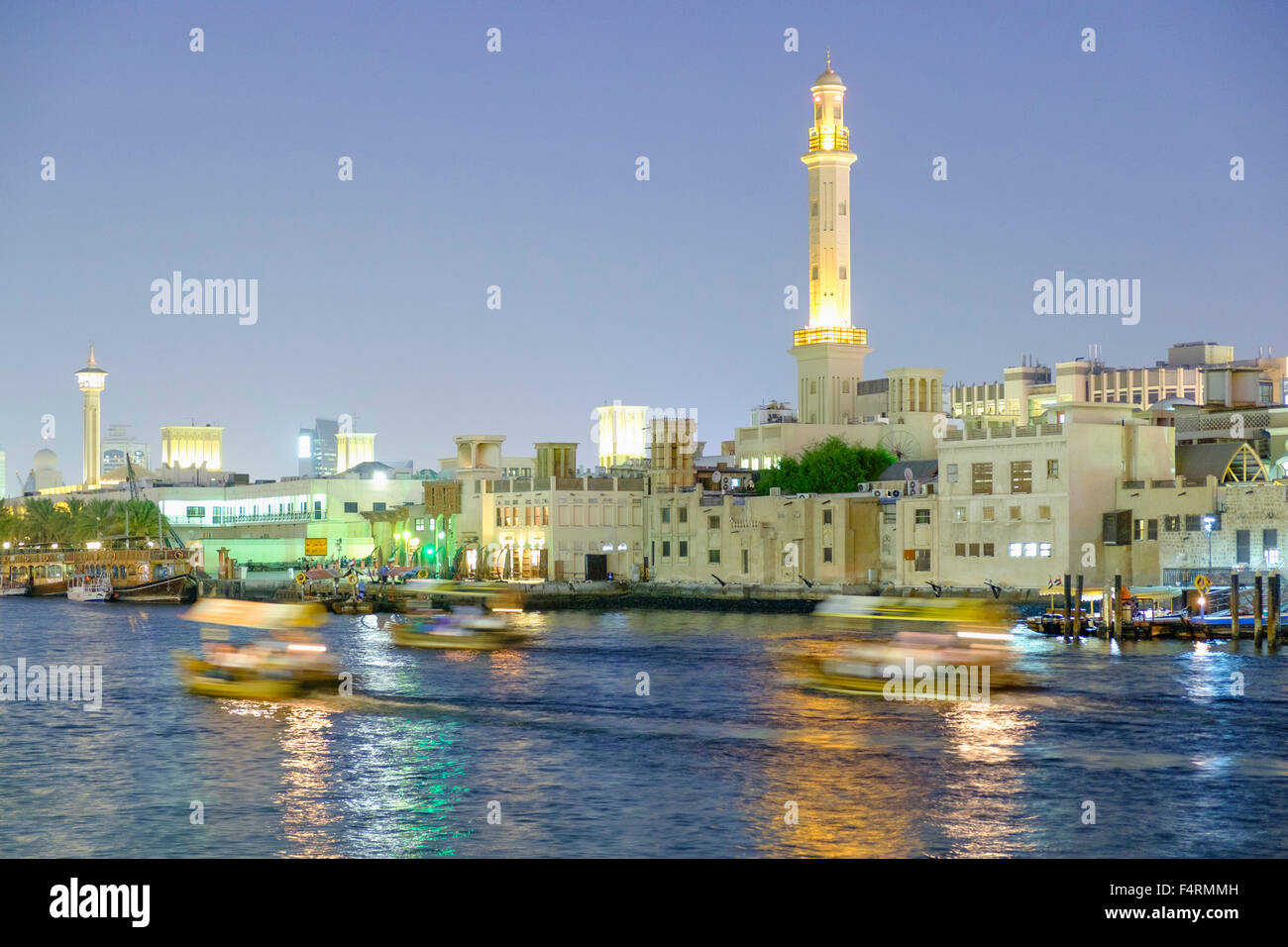 Night view of abra water taxis on The Creek in Deira in old Dubai united Arab Emirates Stock Photo