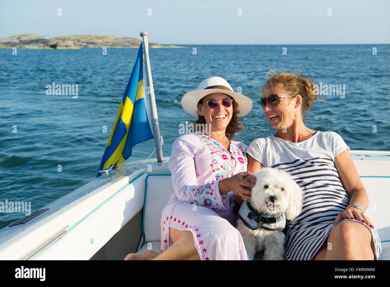 Sweden, Sodermanland, Stockholm Archipelago, Norsten, Portrait of two mature women on boat Stock Photo