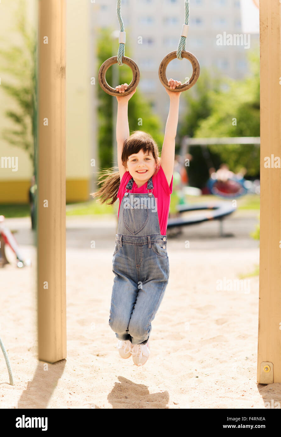 happy little girl on children playground Stock Photo - Alamy