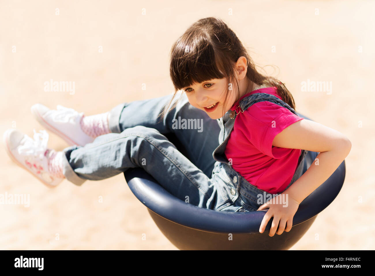 happy little girl on children playground Stock Photo - Alamy