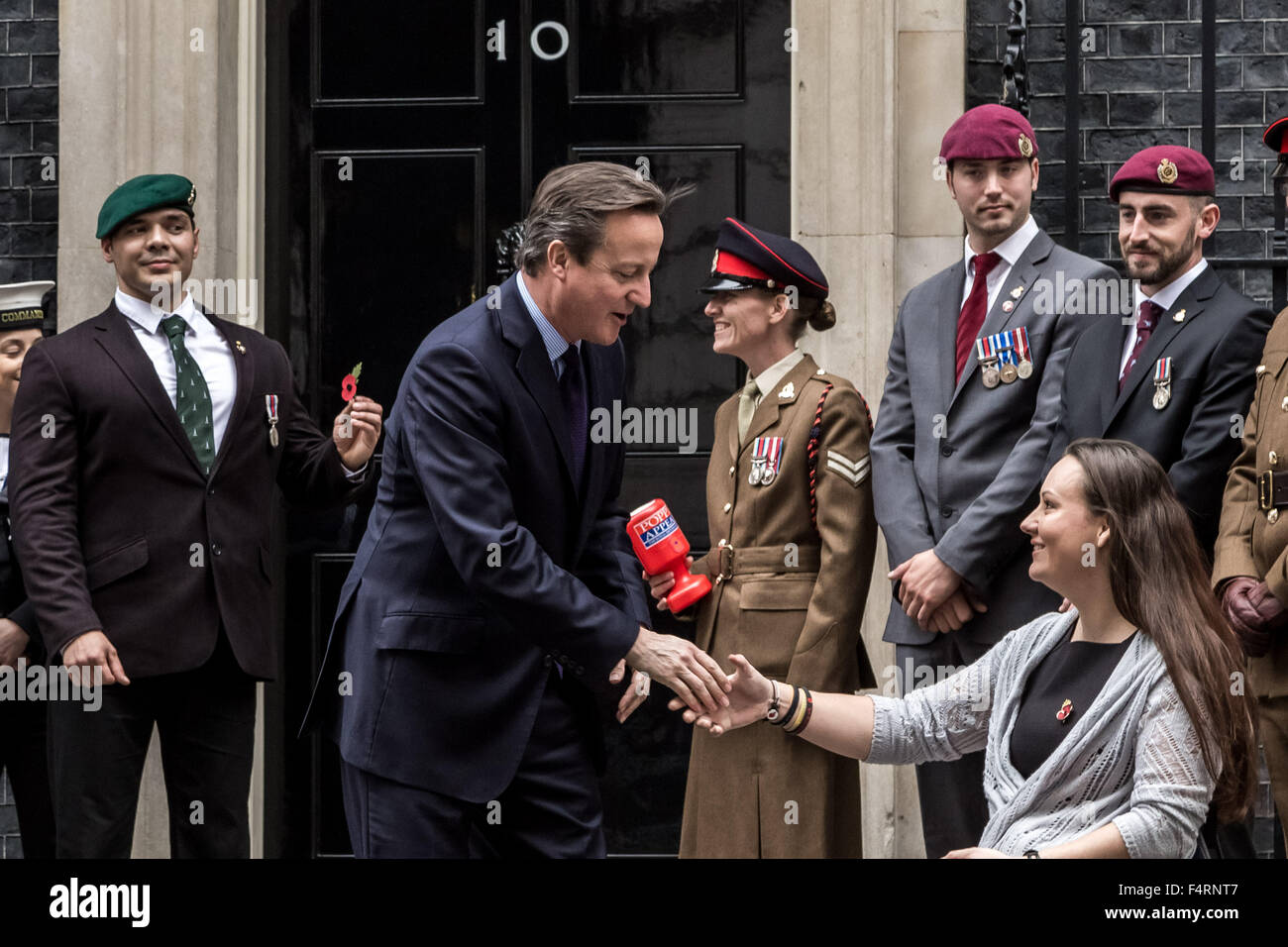 London, UK. 22nd October, 2015. Royal British Legion Poppy Appeal annual launch with parade passing through London delivering the first poppy to Prime Minister David Cameron at Downing Street Credit:  Guy Corbishley/Alamy Live News Stock Photo