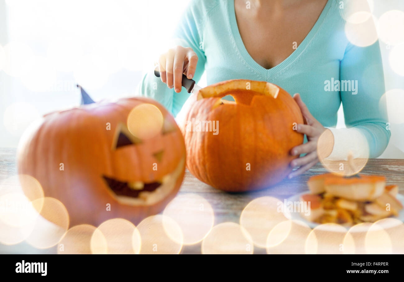 close up of woman with pumpkins at home Stock Photo