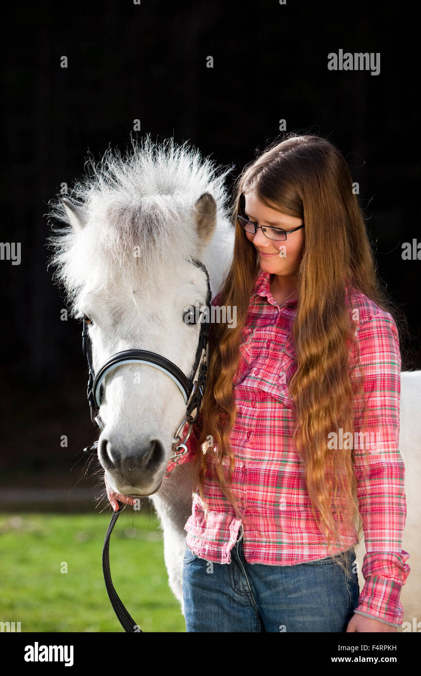 Girl with a pony, Schimmel, Austria Stock Photo