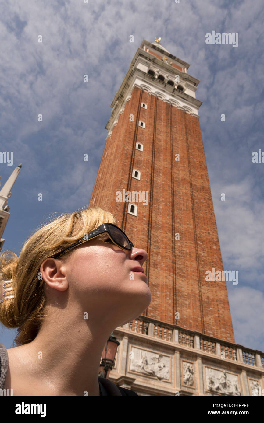 Campanile and woman looking up Stock Photo