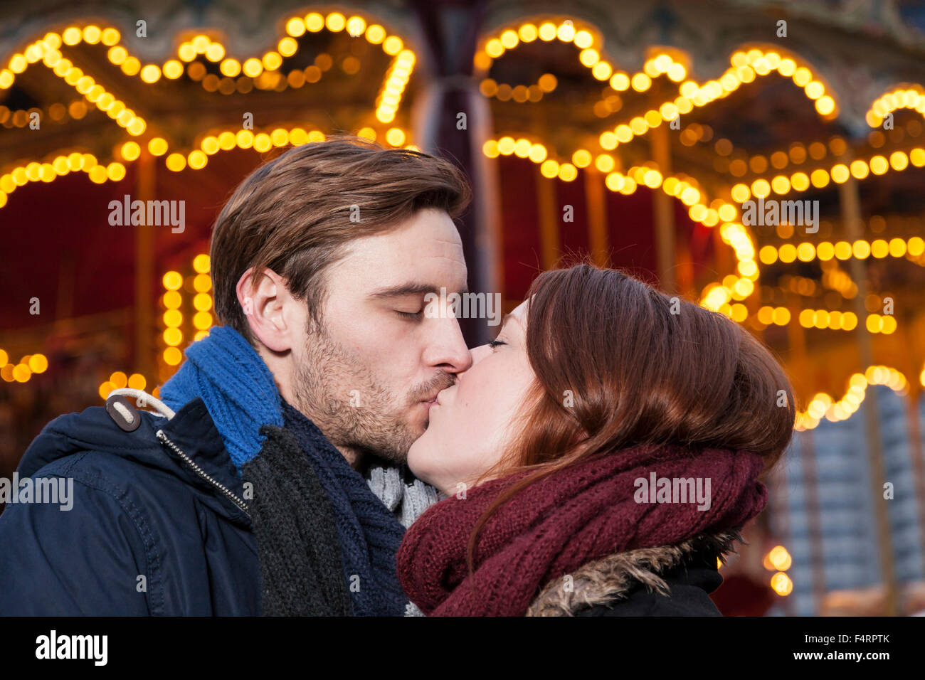 couple kissing on christmas marekt Stock Photo