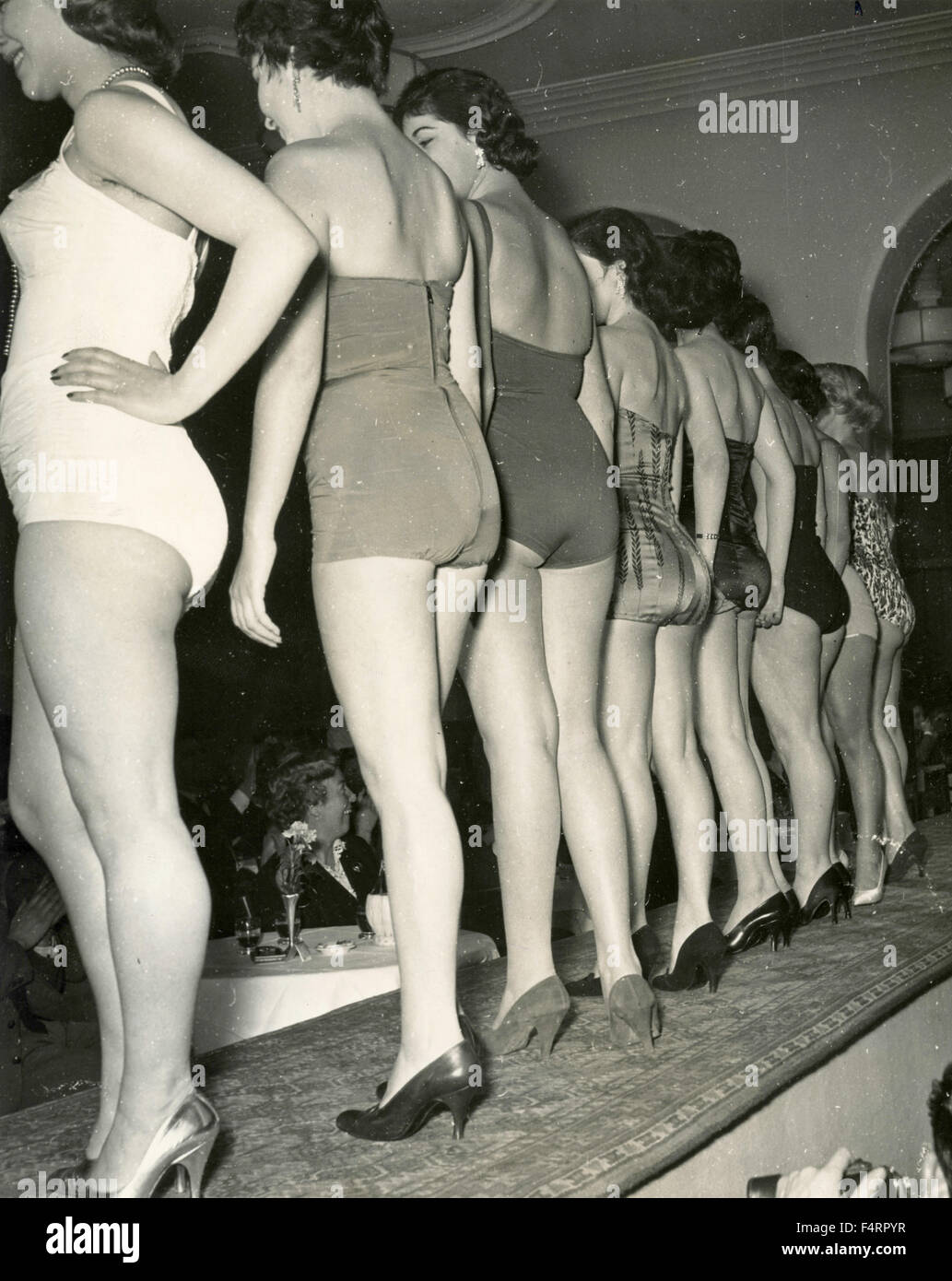Parade of Misses viewed from behind, Italy Stock Photo