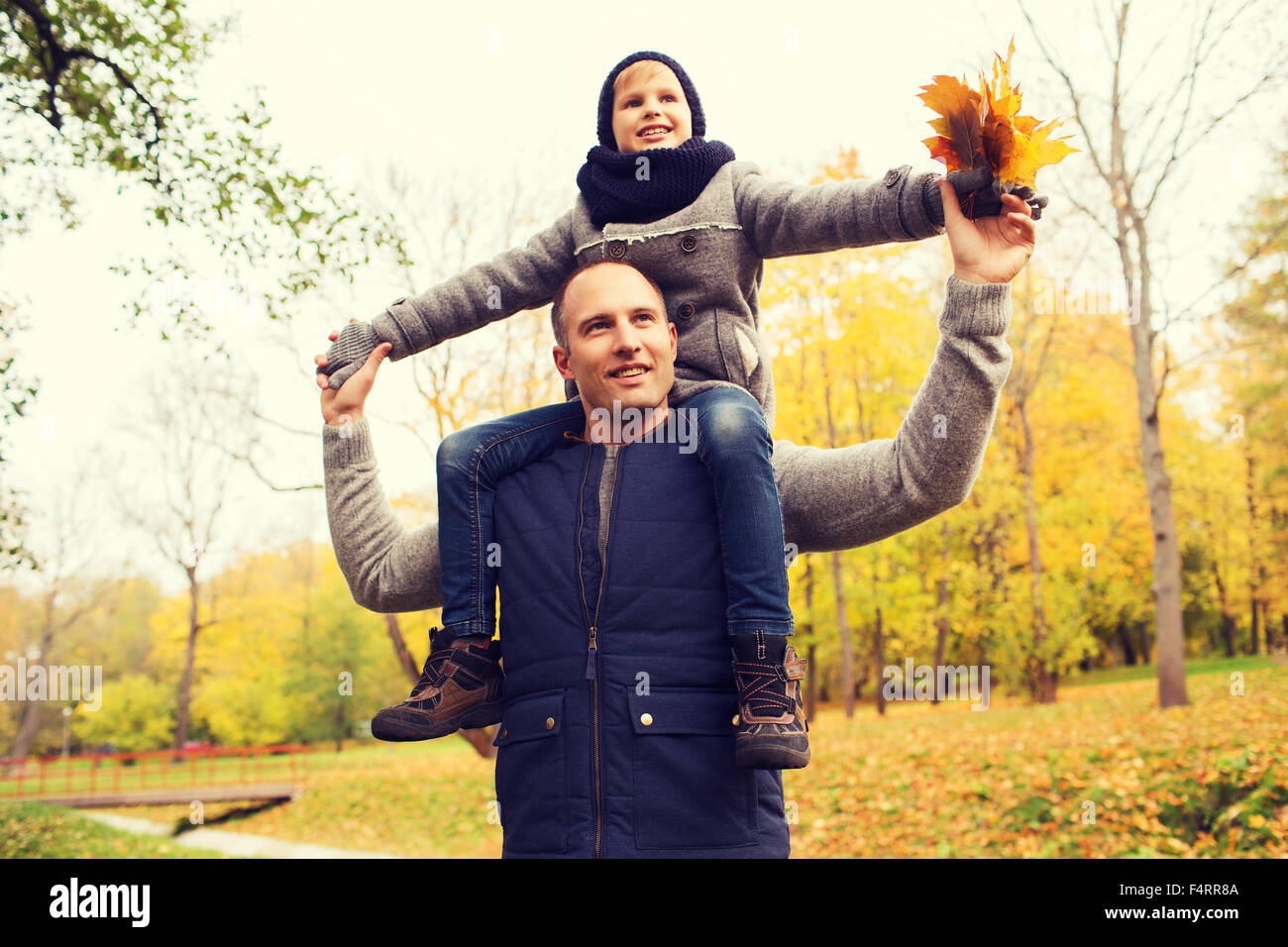 happy family having fun in autumn park Stock Photo - Alamy