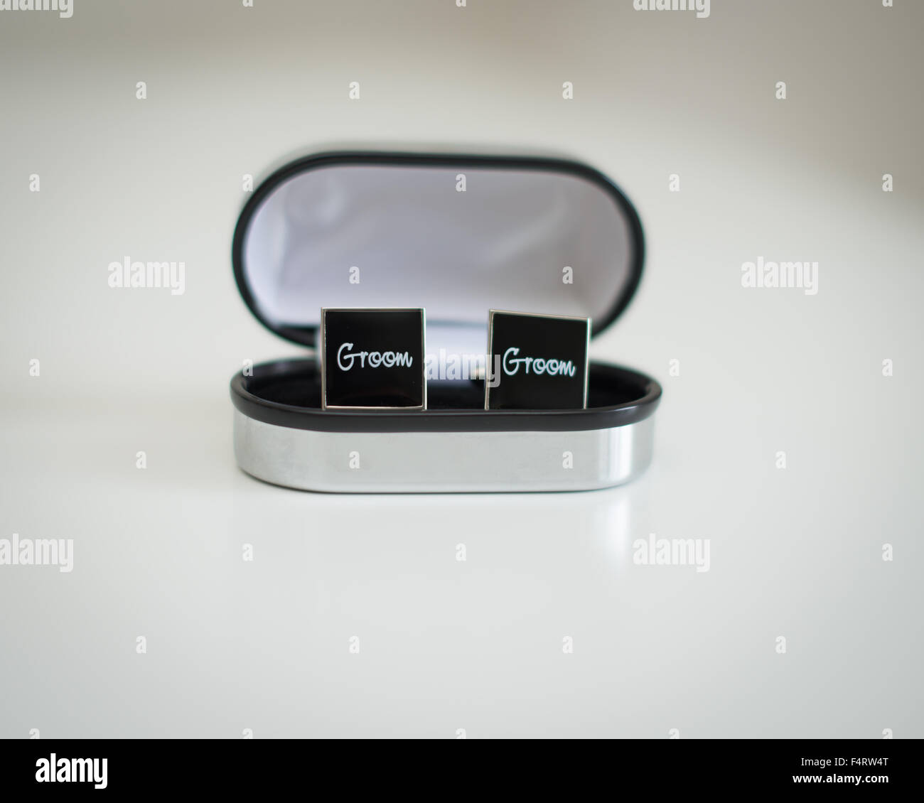 cuff links black with silver engraving Groom in presentation box wedding day present from best man Stock Photo