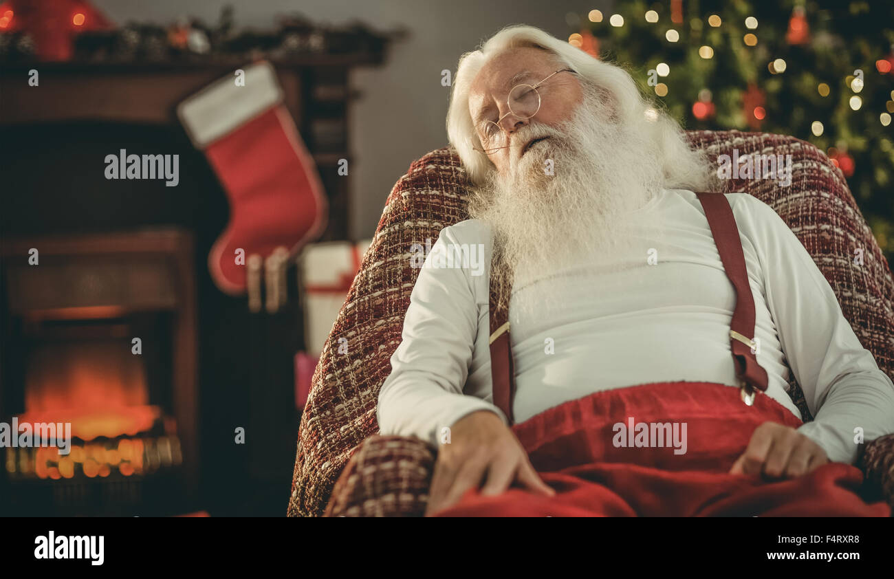 Santa claus napping on the armchair Stock Photo - Alamy