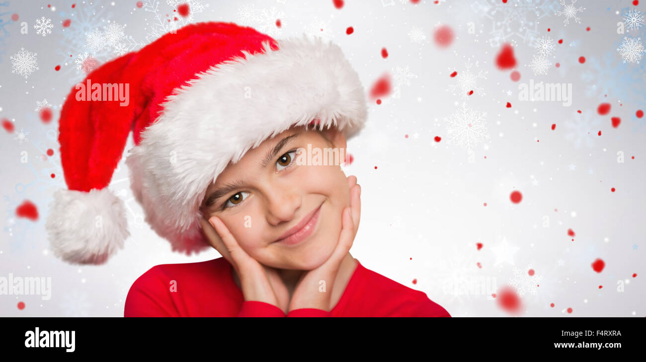 Composite image of festive little girl smiling at camera Stock Photo ...