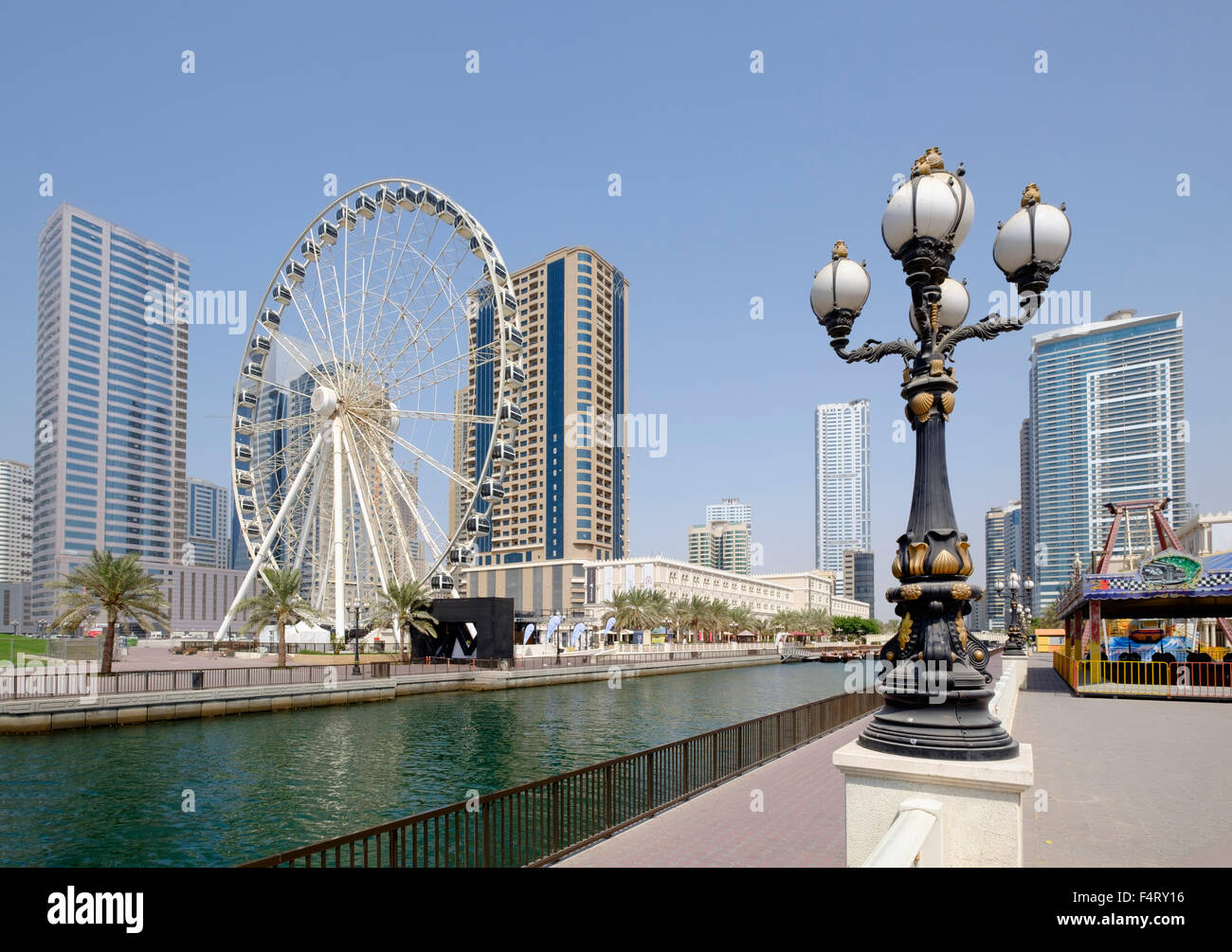 View of Eye of the Emirates ferris wheel and Al Qasba entertainment district in Sharjah United Arab Emirates Stock Photo