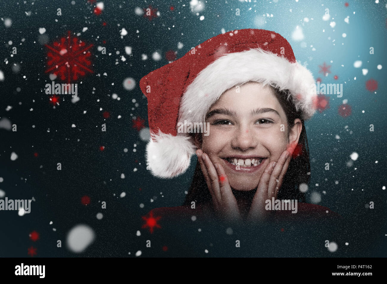 Composite image of festive little girl smiling at camera Stock Photo ...