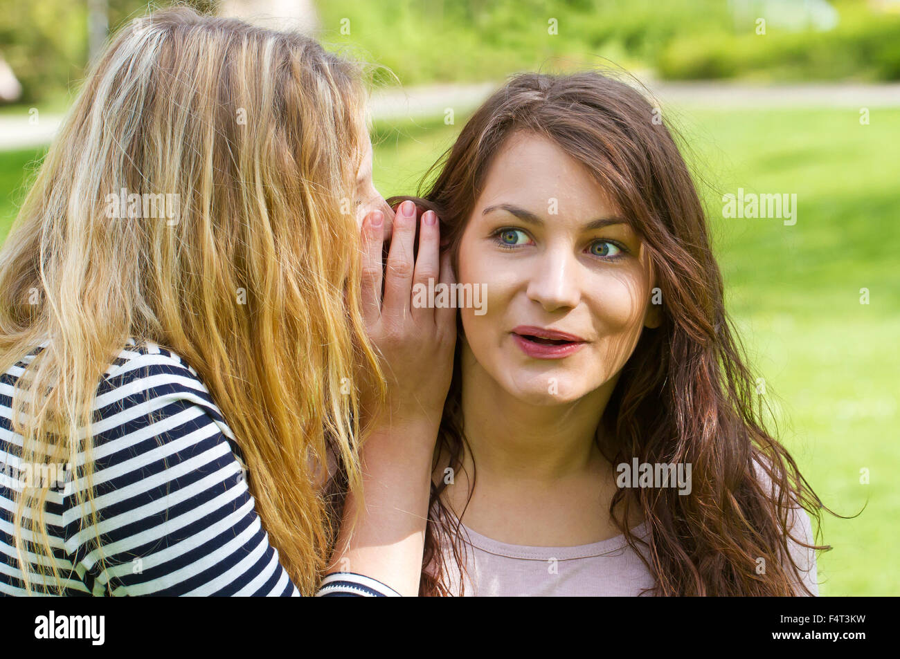 Girl telling news Stock Photo