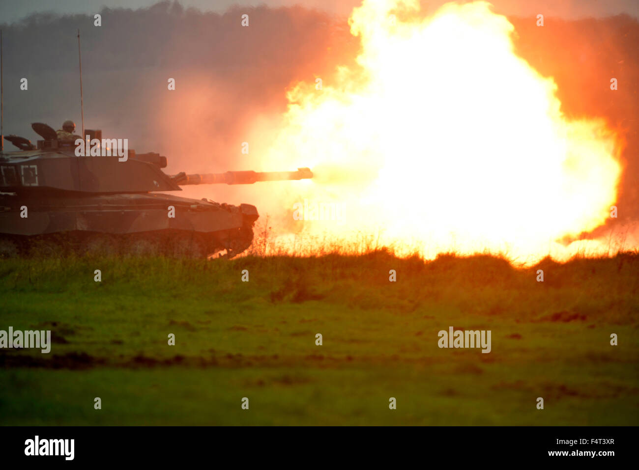 Challenger tank firing during tank exercise, Britain, UK Stock Photo