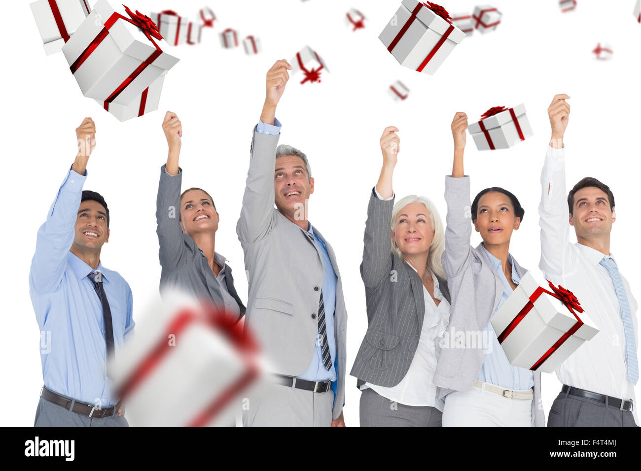 Composite image of smiling business people raising hands Stock Photo
