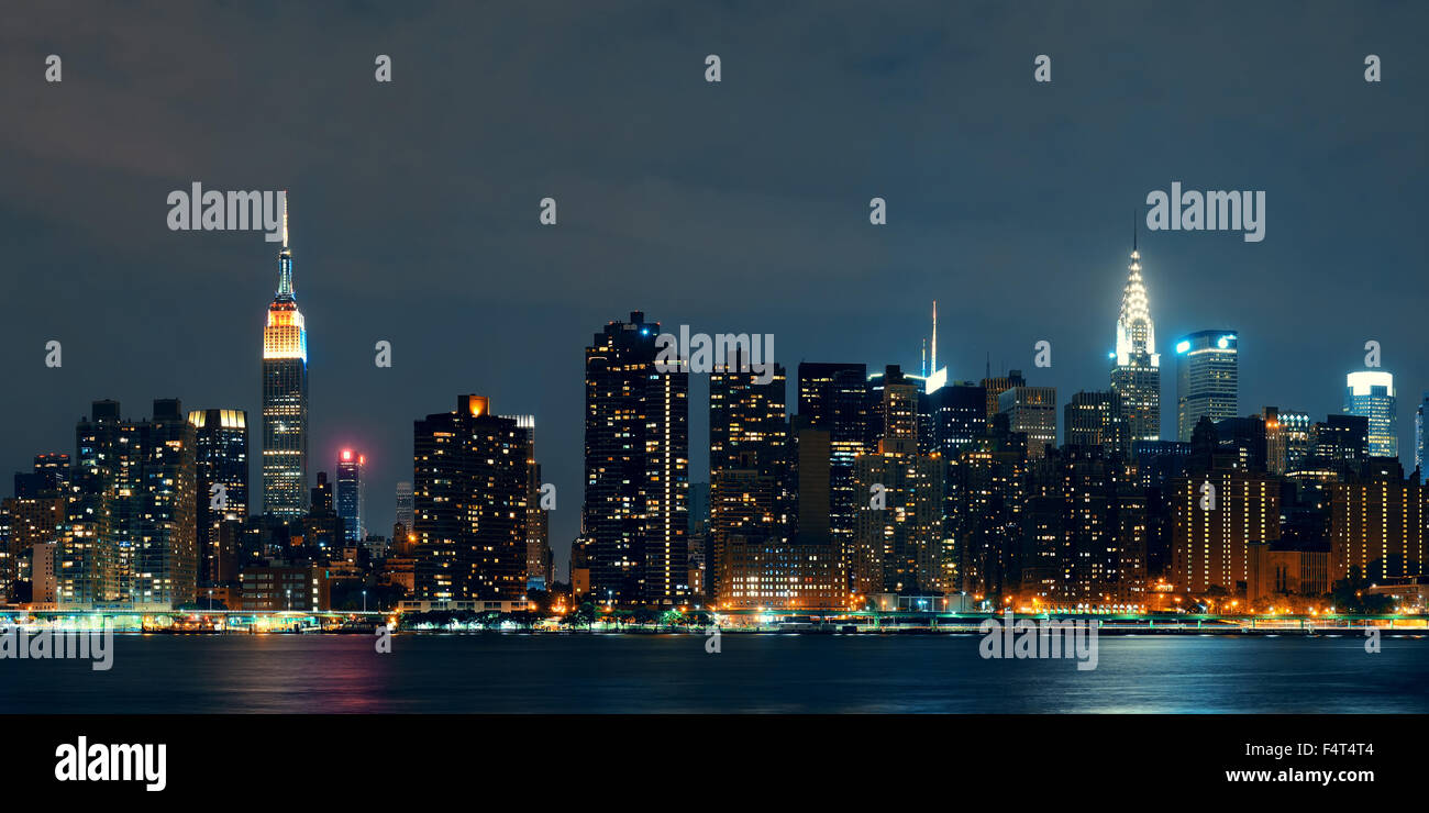 Midtown Manhattan skyline at dusk panorama over East River Stock Photo ...