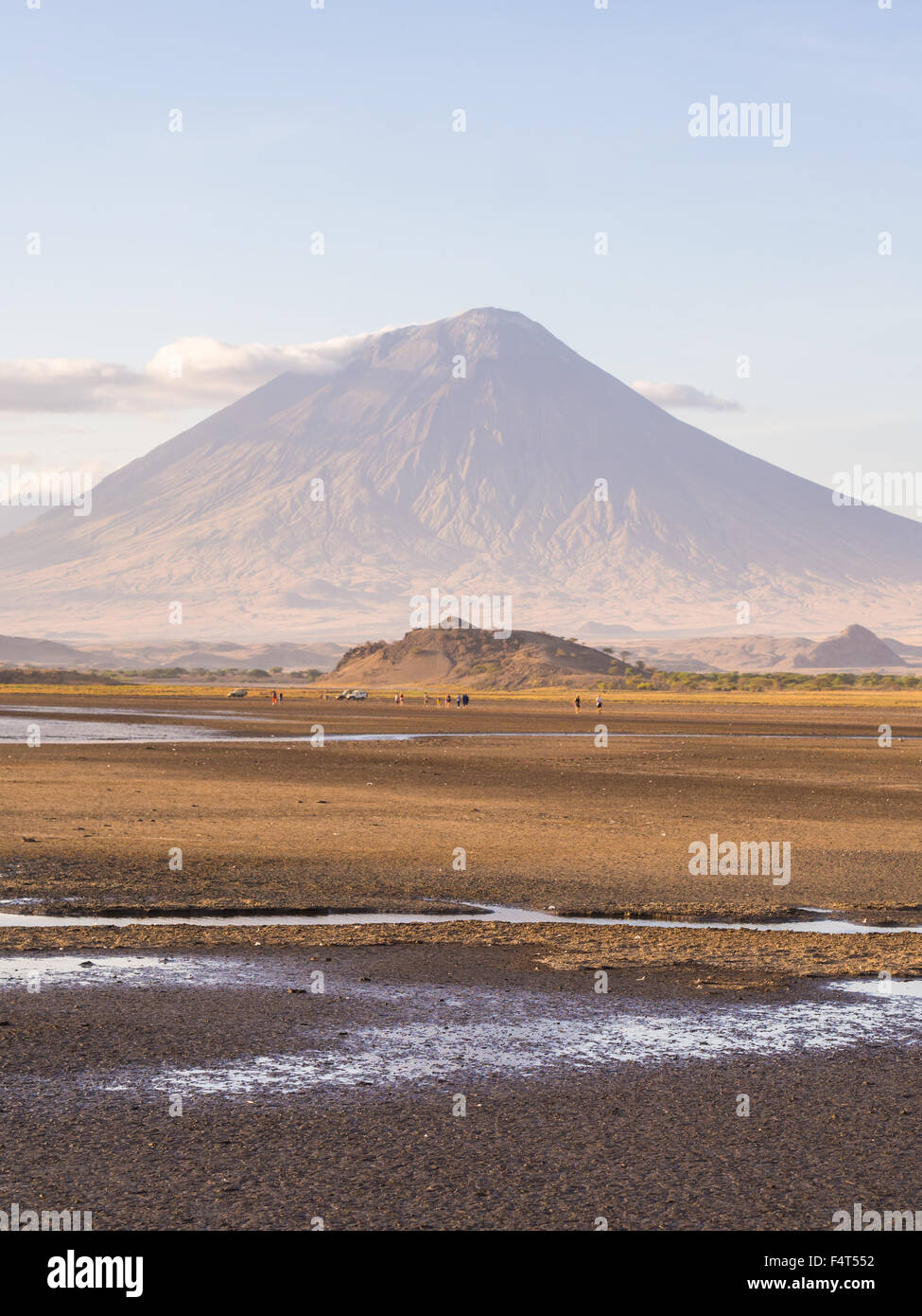 Ol Doinyo Lengai (Mountain of God in the Maasai language), an active volcano in the Northen Tanzania, seen from the dried Lake N Stock Photo
