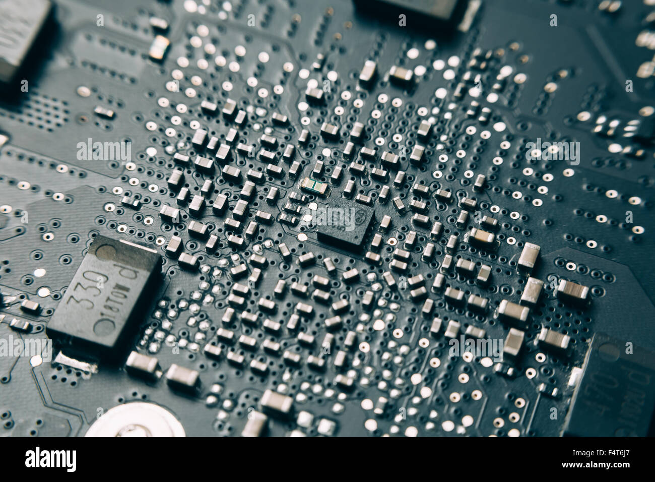 Printed Circuit Board with electrical components. Stock Photo