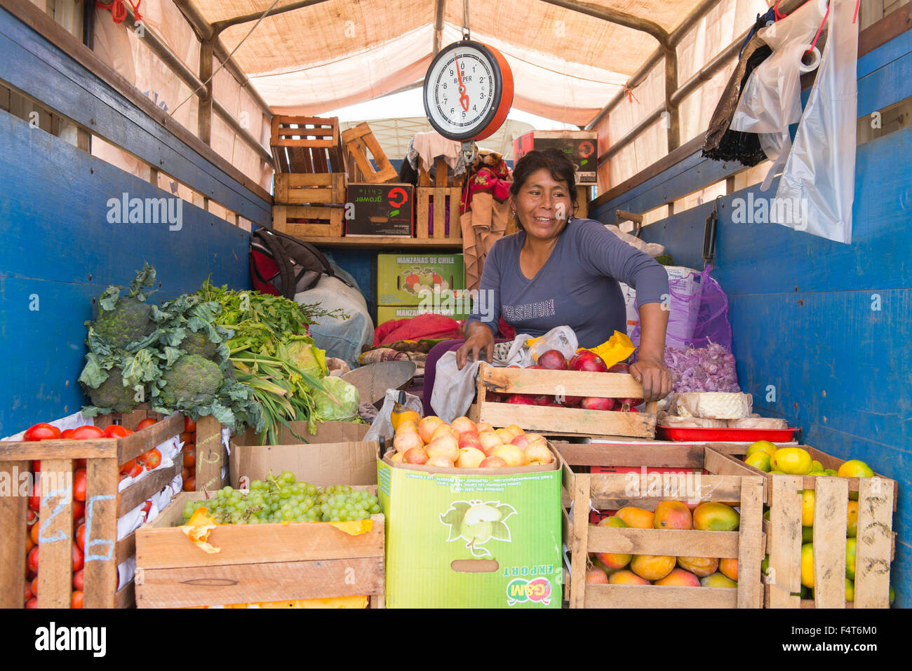 South America, Latin America, Peru, Amazonia, Manu, woman selling vegetables out of truck Stock Photo